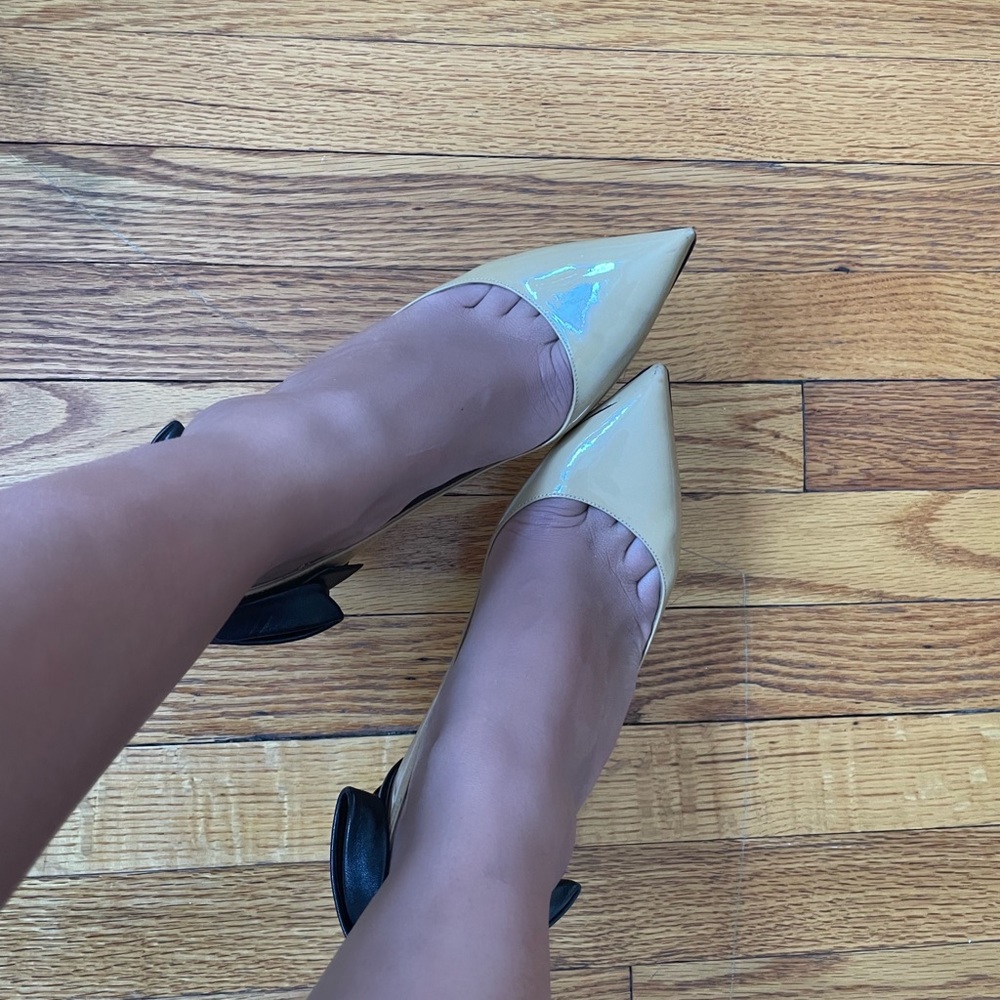 Beautiful unique and chic nude/black bow Valentino heels😍